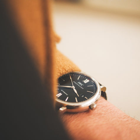 Close up of someone looking at their wrist watch