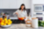 Girl cooking in kitchen with pots and ingredients out