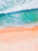 surfers on the beach from above
