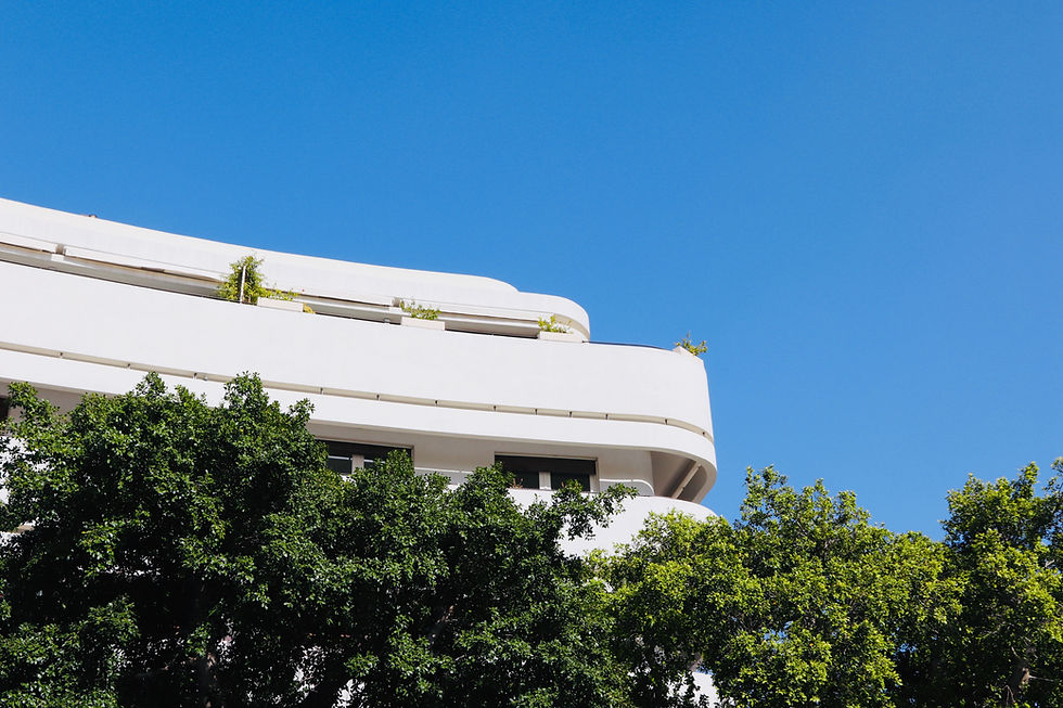 a white Bauhaus building in Tel Aviv