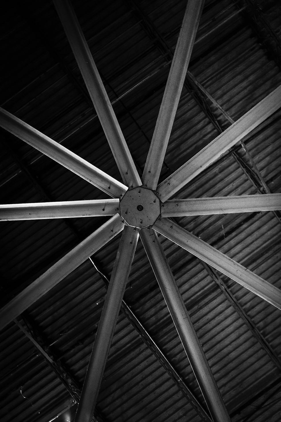 Industrial style ceiling fan installed in a commercial space