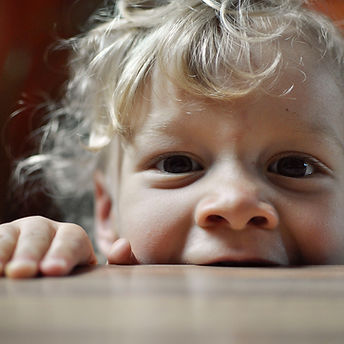 Image by mali desha

Toddler boy biting a wooden table