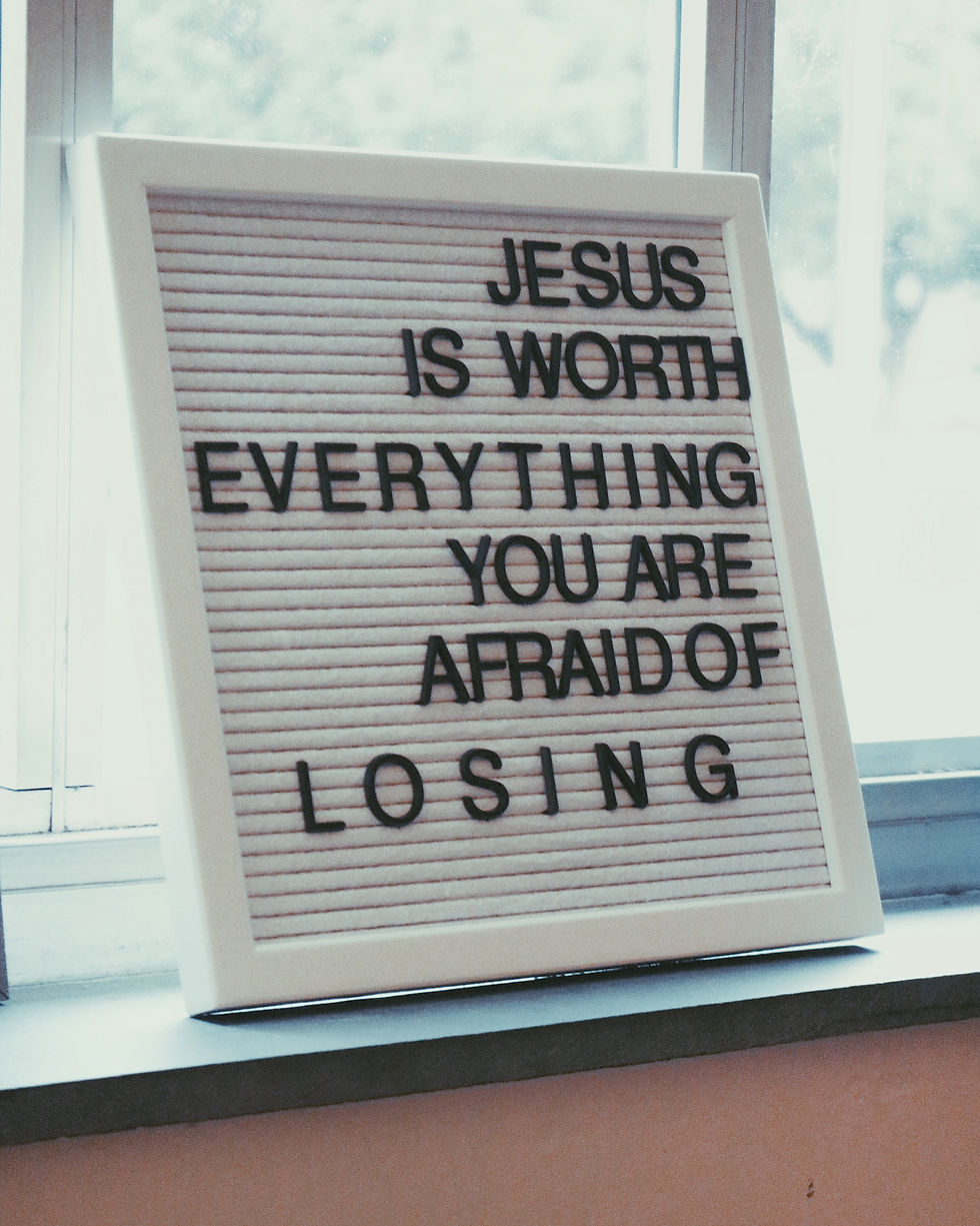 Peg board reading "Jesus is worth everything you are afraid of losing"