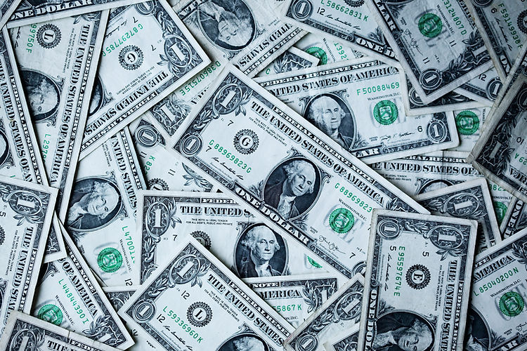 Scattered US one dollar bills