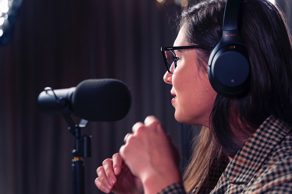 Person speaking into a microphone