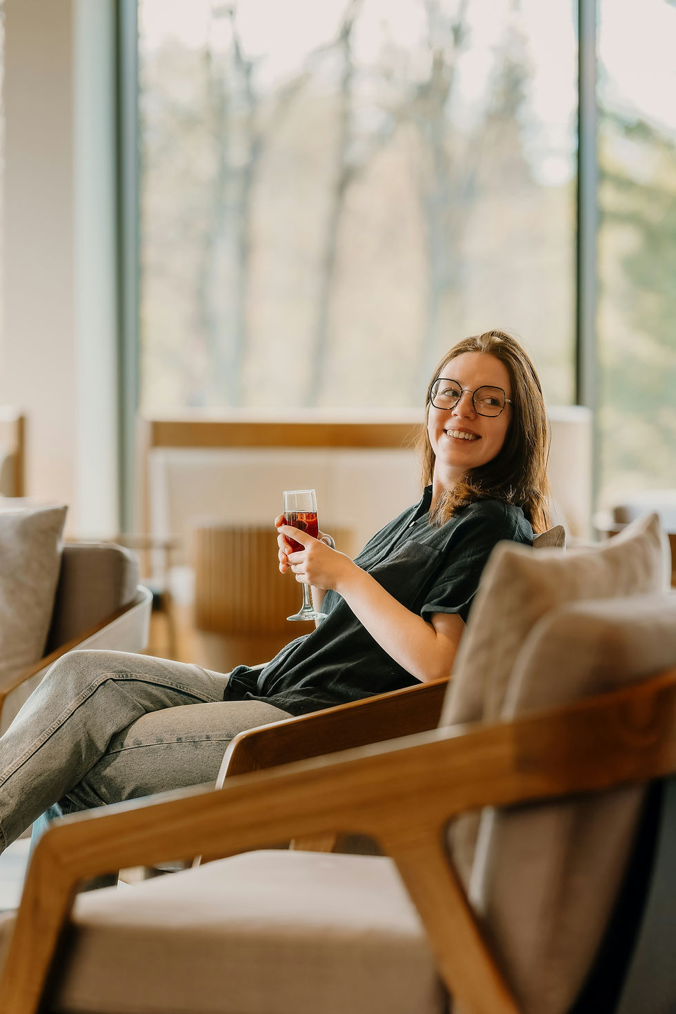 Woman relaxing at home with a mug during the two-week wait after ovulation.