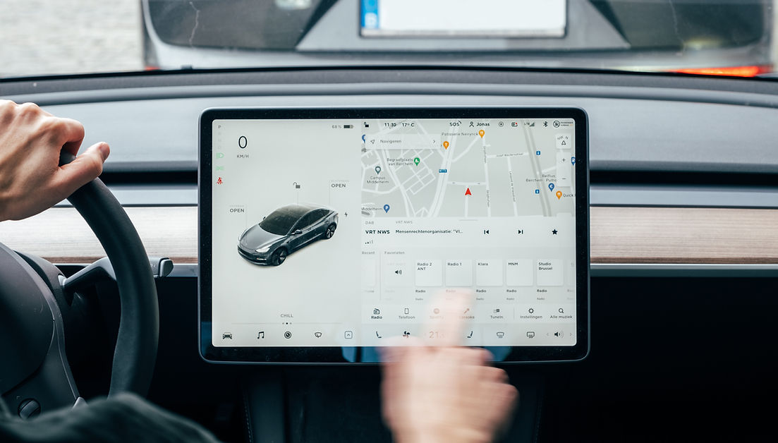 Interior screen on EV vehicle showing map with charging location