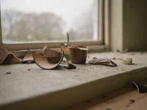 Broken pot on shelf