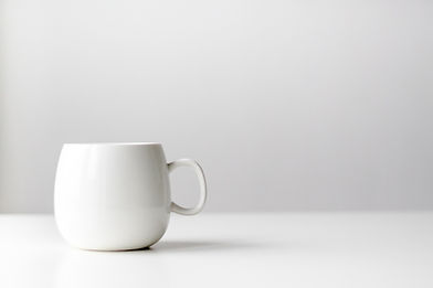 Coffee mug on a minimalist empty surface