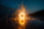 A dark sky with spinning and streaking lights