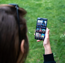 Woman checking game schedule on phone