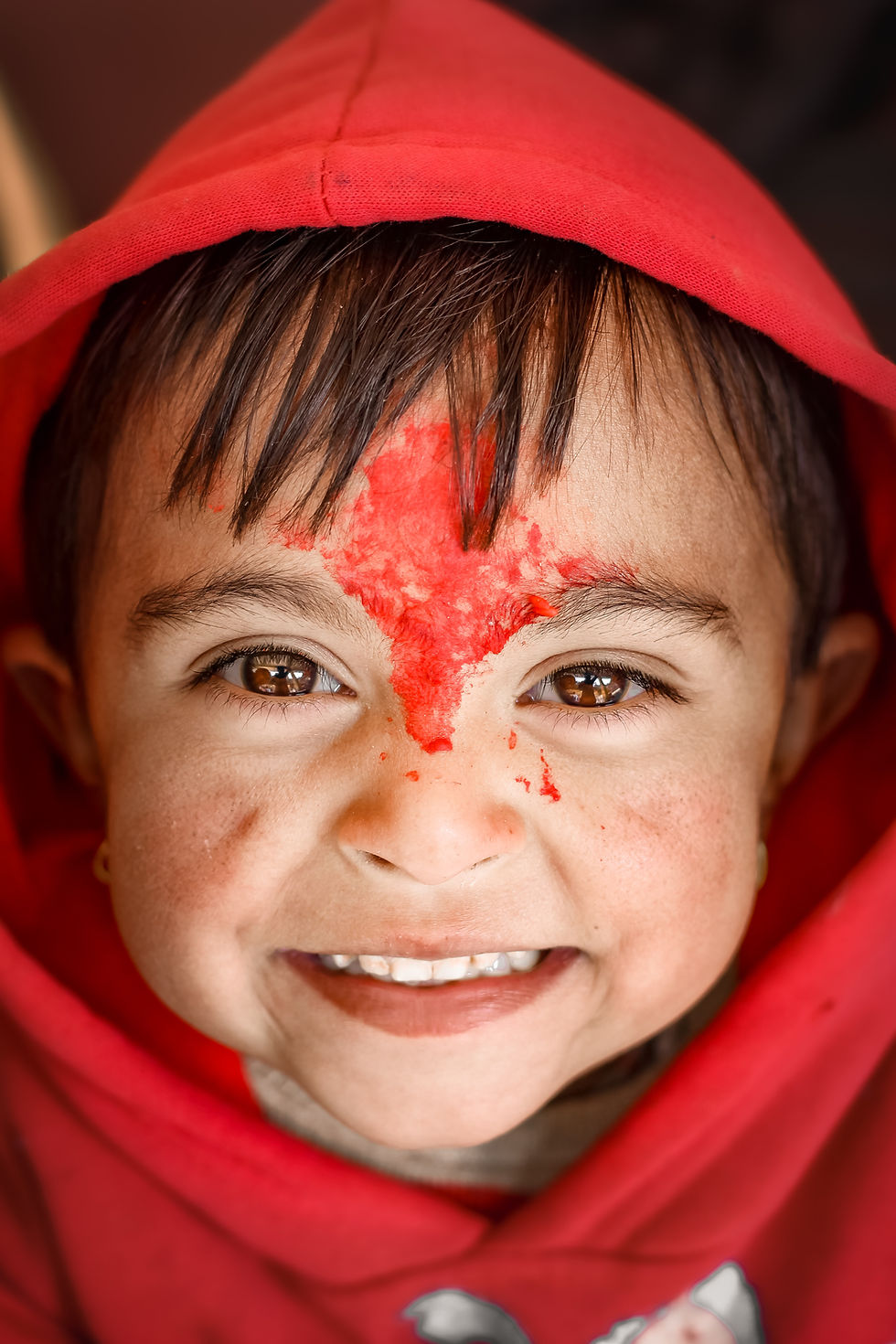 kid with red color on his had (CID)