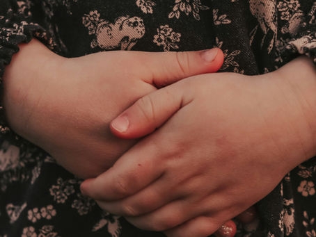 Woman holding her stomach during perimenopause, experiencing hormonal nausea — a recognised but under-discussed symptom of the menopausal transition from Vibrance Way