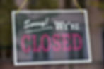 A closure sign on a business window