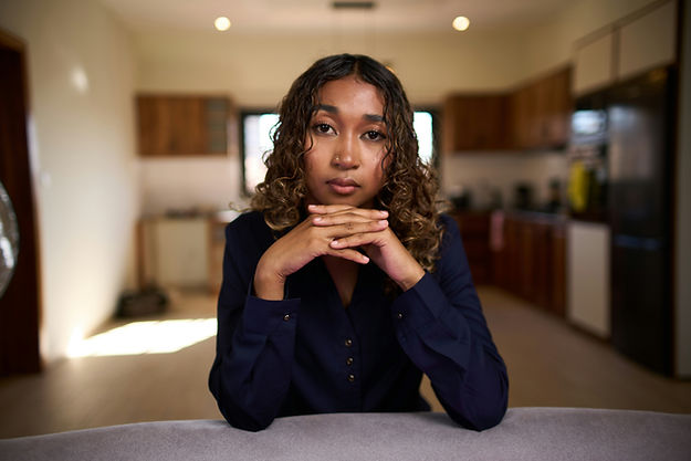 Professional Black woman in leadership reflecting on high functioning depression symptoms