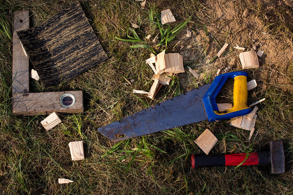 saw and other tools on ground
