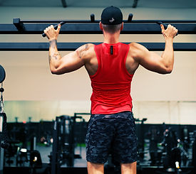 Doorway pull-up bar for home strength training — chin-ups and inverted rows for BUILD FIRST Foundation Schedule