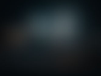 An illuminated infinity sign and an illuminated heart pierce a dark night.