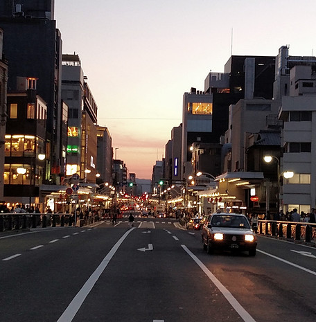 City street with cars and building