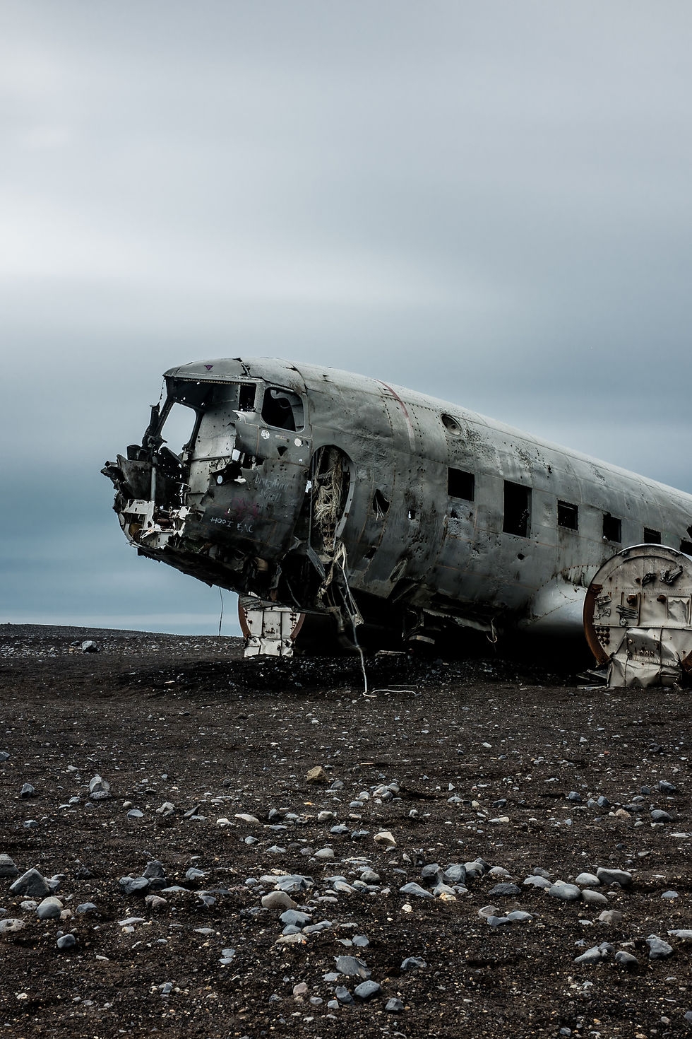 Old war plane deteriorating on the beach