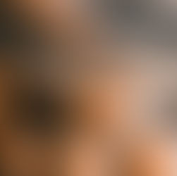 Pastries on a wooden board with chocolate, a rolling pin, whisk, butter, eggs, and sugar on a striped cloth. Cozy baking setting.