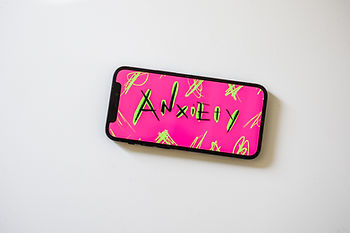 Mobile Phone with the word Anxiety on the screen