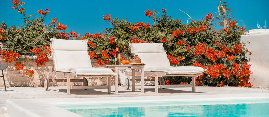 Beautiful pool set agains a bed of flowers