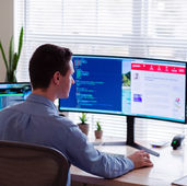 Photo of a man designing a webstie