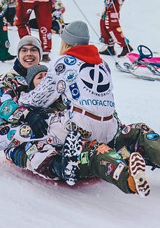family snow sledding