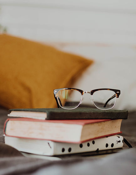 Vintage glasses on a stack of vintage books