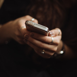 persons hands holding a phone