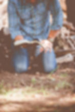 Kneeling and reading the Bible