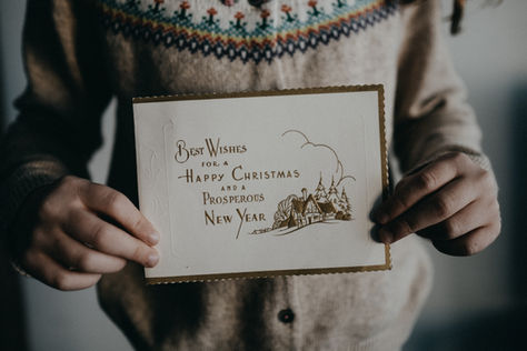 holding a holiday card