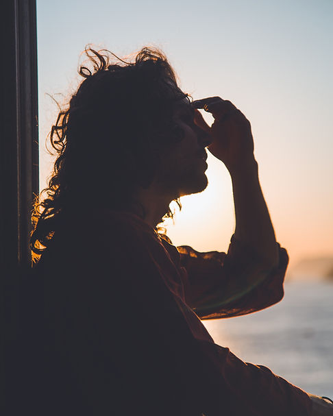 woman holding head from headache hidration IV