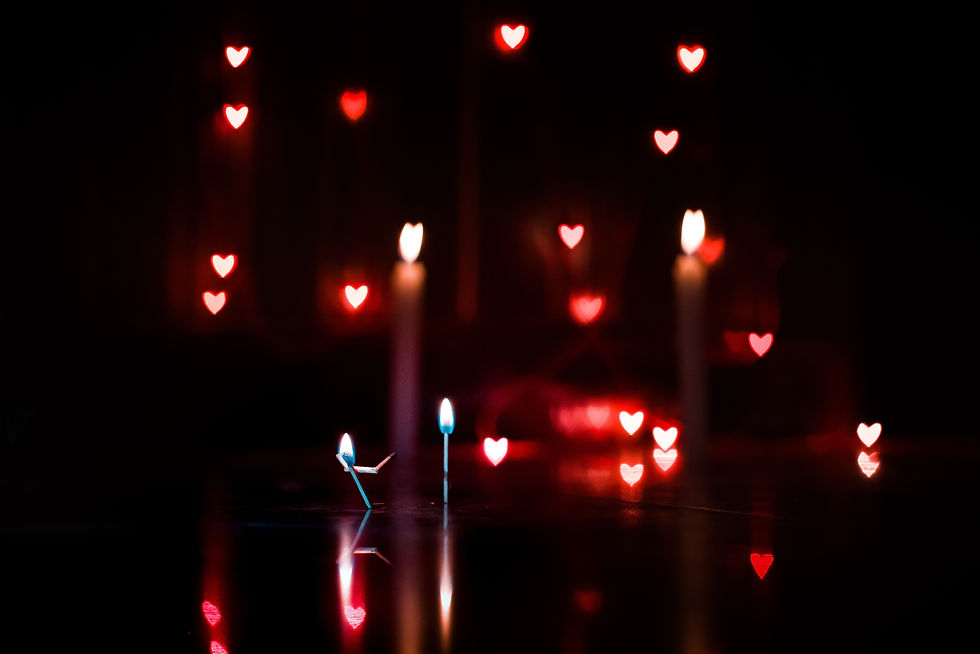 Image of burning matches with heart-lights floating around.