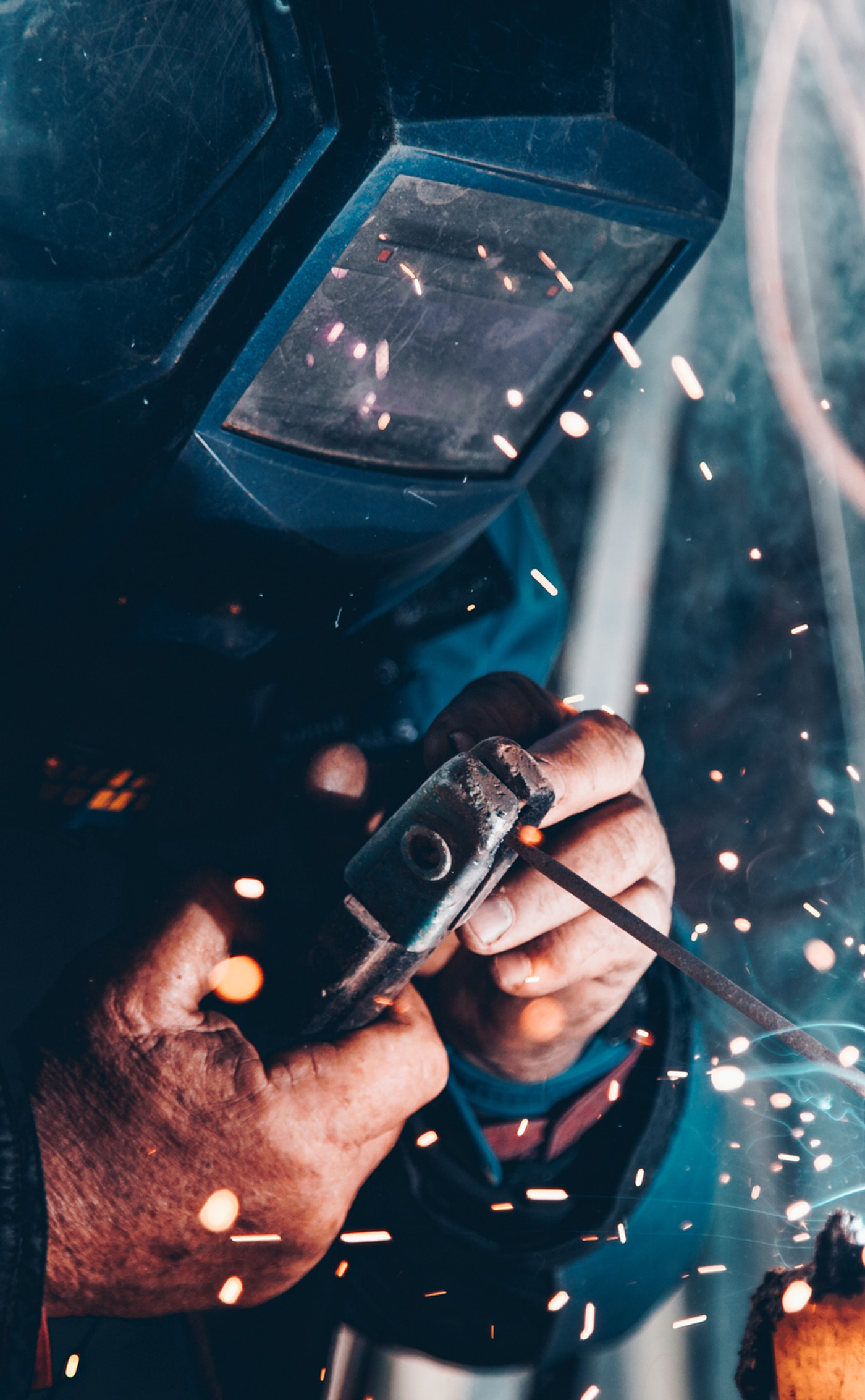 mechanic using welding tool