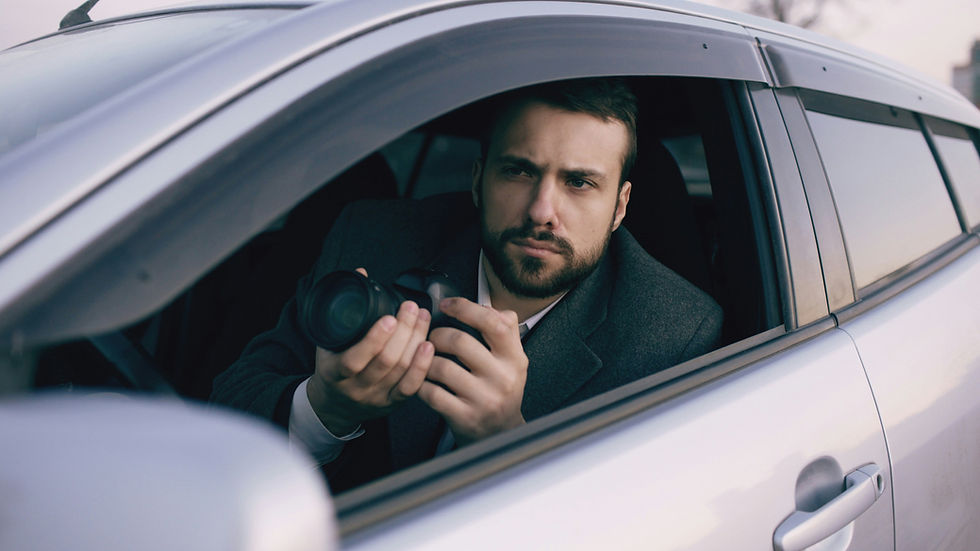 Private investigator conducting covert surveillance