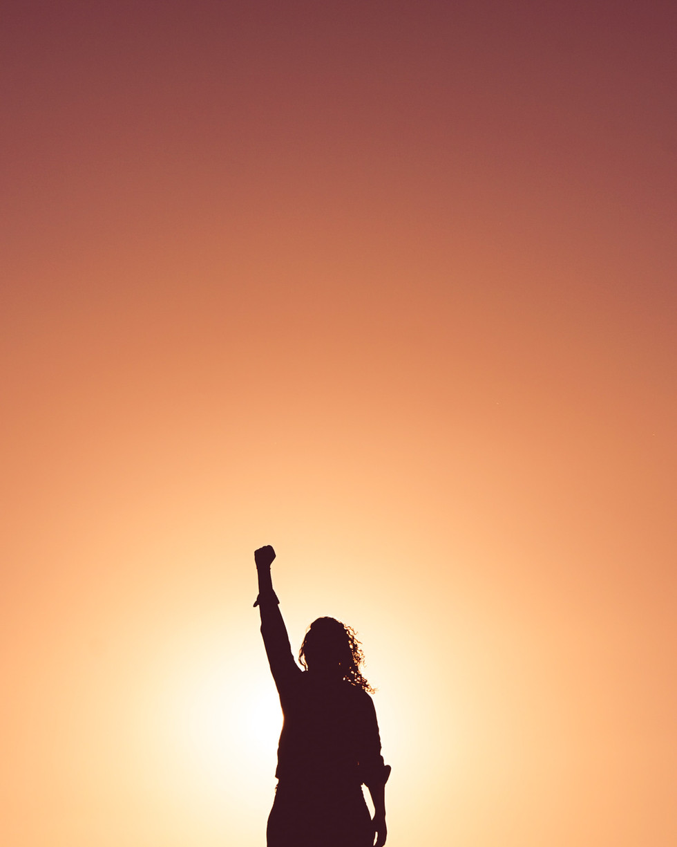 person reaching for the sky