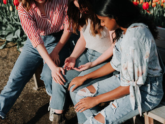 Group of friends comforting one another