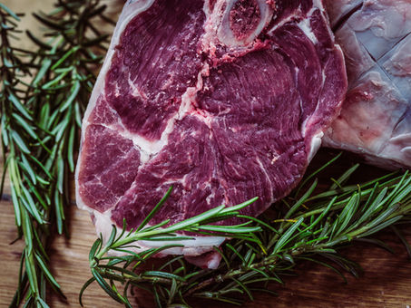 A steak with rosemary.