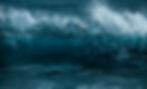 Powerful ocean wave crashing, foamy white spray above deep blue water. No visible text. Dynamic, energetic mood.