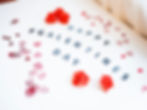 Red roses and heart confetti surround "Happy Galentine's Day" text on white background, creating a festive and cheerful mood.