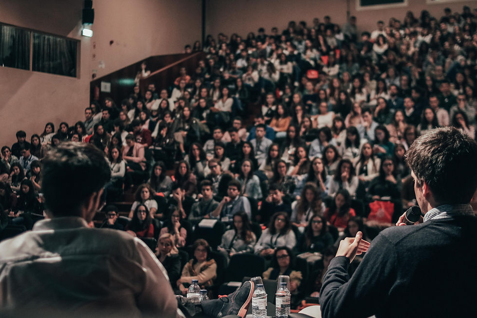 audience of people listening to speakers