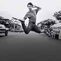 man jumping on a street