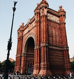 Arc de Triomf Barcelona - 1888 red-brick triumphal arch with ornate sculptures and palm-lined