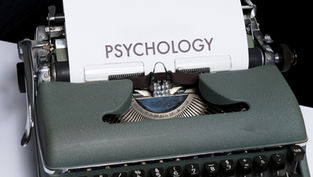 a piece of paper that has the word "psychology" on it that is in a typewriter.
