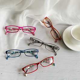 five pairs of eyeglasses of assorted colors