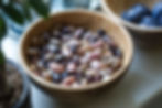 Dried beans in a bowl being soaked for faster cooking.