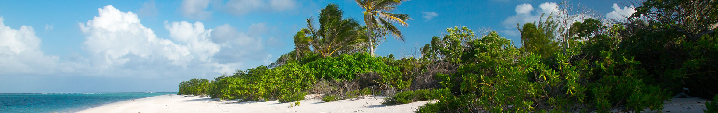Majuro atoll, coral reefs, and traditional villages illustrate the Marshall Islands’ tropical beauty and heritage