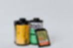 A canister of Fuji C200, Kodak Pro Image 100 and an SD card.